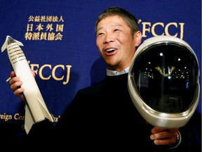 Japanese billionaire Yusaku Maezawa, who has been chosen as the first private passenger by SpaceX, poses for photos as he attends a news conference at the Foreign Correspondents' Club of Japan in Tokyo, Japan, October 9, 2018.   REUTERS/Toru Hanai/File Photo