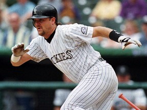 Colorado Rockies' Larry Walker breaks from the batter's box after laying down a bunt at Denver's Coors Field on July 23, 1998.