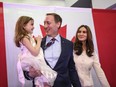 Peter MacKay, centre, holds his daughter Valentia MacKay as his wife Nazanin Afshin-Jam, looks on following MacKay's official campaign launch for leader of the Conservative Party of Canada in Stellarton, N.S. on Saturday, January 25, 2020.