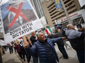 In Toronto on Friday, Jan. 3, 2020, Iranian-Canadians cheered at the news that Iran's military chief had been killed by a U.S. strike at Baghdad airport.