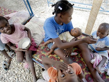 From left: Nathaelle Valentine, 9, Judith Innocent, 14, Daniella Gerusma, 11 months, Jonas Espérance, 2, and Miorra Na, 7 (front), at La Maison Espoir d'enfants orphanage in Port-au-Prince, Haiti, on January 19, 2010.