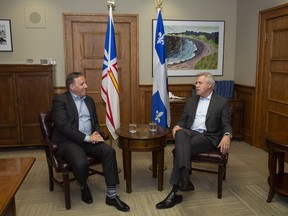 Quebec Premier Francois Legault, left, and Newfoundland and Labrador Premier Dwight Ball sit for a meeting ahead of the Atlantic Premiers' conference, at the Confederation Building in St. John's, Sunday, Jan. 12, 2020.