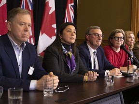 Dr. David Williams, centre, Chief Medical Officer of Health, is joined by Andy Smith, President and CEO of Sunnybrook Health Sciences, left to right, Dr. Eileen de Villa, Medical Officer of Health for the City of Toronto, Dr. Barbara Yaffe, Associate Chief Medical Officer of Health, Christine Elliott, Minister of Health, and Dr. Peter Donnelly, President and Chief Executive Officer of Public Health Ontario, as they attend a news conference in Toronto on Saturday, January 25, 2020, as officials announce that Canada's first presumptive positive case of the Coronavirus is being treated at Toronto's Sunnybrook Health Sciences Centre, after arriving on a flight from China.