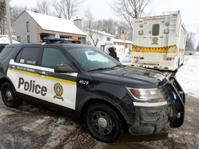 Police vehicles cordon off an area outside a home in Mascouche, Que., Thursday, Jan.16, 2020. Quebec provincial police are investigating the killing of a woman in her 30s inside a home in Mascouche.