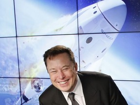 SpaceX founder and chief engineer Elon Musk reacts at a post-launch news conference to discuss the SpaceX Crew Dragon astronaut capsule in-flight abort test at the Kennedy Space Center in Cape Canaveral, Fla, on Sunday, Jan. 19, 2020.