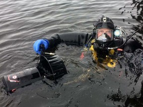 Sûreté du Québec diver with a special propulsion device used in their searches.
