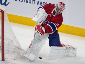 Canadiens goaltender Carey Price attempts to clear the puck off the boards, but ended up with a delay of game penalty against the Florida Panthers at the Bell Centre in Montreal on Saturday, Feb. 1, 2020.