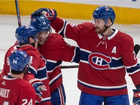 Canadiens defenceman Jeff Petry (right) celebrates with teammates after Brendan Gallagher scored during third period of NHL game against the Florida Panthers at the Bell Centre in Montreal on Feb. 1, 2020.