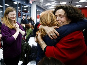 Sue Montgomery gets a little emotional as she is warmly greeted by an over-capacity crowd at the N.D.G.-C.D.N. borough council in Montreal on Monday, Feb. 3, 2020.