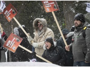 Protesters yell out slogans during a noon time protest outside the CSDM building Feb. 6, 2020. The protest was against the Quebec government's decision to force the adoption of Bill 40, its controversial school-board reform bill.