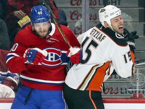 Ducks star Ryan Getzlaf reacts after being checked hard by Canadiens' Joel Armia during third period at the Bell Centre Thursday night.