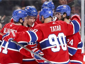 Montreal Canadiens Brendan Gallagher, Tomas Tatar, Phillip Danault and Jeff Petry, rear, celebrate with Nick Suzuki, 14, after his goal during first period of National Hockey League game against the Anaheim Ducks in Montreal Thursday February 6, 2020.
