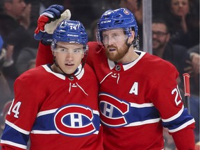 Montreal Canadiens Jeff Petry, right, congratulates Nick Suzuki for his goal against the Anaheim Ducks during first period of National Hockey League game in Montreal Thursday February 6, 2020.