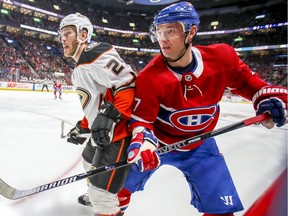 Montreal Canadiens Ilya Kovalchuk, right, tries to squeeze past Anaheim Ducks Carter Rowney during first period of National Hockey League game in Montreal Thursday February 6, 2020.