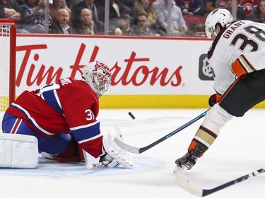 Montreal Canadiens Carey Price stops shot by Anaheim Ducks Derek Grant during second period of National Hockey League game in Montreal Thursday February 6, 2020.