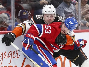 Anaheim Ducks Max Jones grabs Montreal Canadiens Victor Mete around the neck during second period of National Hockey League game in Montreal Thursday February 6, 2020.