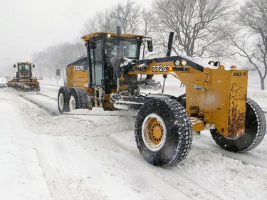 Snowplows clear Park Ave. during a snow storm in Montreal on  Friday, Feb. 7, 2020.