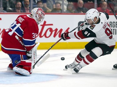 Montreal Canadiens Carey Price stops Arizona Coyotes Taylor Hall in close during second period of National Hockey League game in Montreal Monday February 10, 2020.