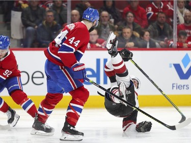 Nate Thomson checks an Arizona Coyotes player during third period of National Hockey League game in Montreal Monday February 10, 2020.