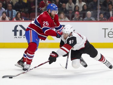 Montreal Canadiens Jeff Petry pushes Arizona Coyotes Taylor Hall to the ice during second period of National Hockey League game in Montreal Monday February 10, 2020.
