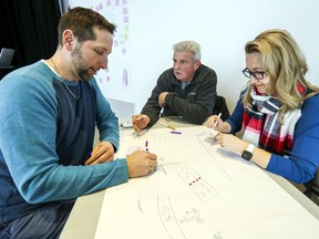 Jean-Pierre Lanthier, left, Charles Lariviére and Alexandra Enache take part in a workshop during Rêvons Pierrefonds-Roxboro 2025, at the Pierrefonds Public Library.