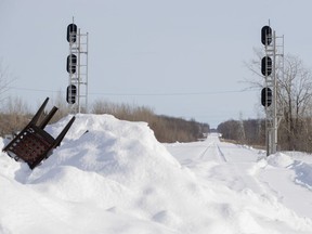 MONTREAL, QUE.: February 12, 2020 -- A mountain of snow covers two rail lines during a blockade of the CP Rail tracks in Kahnawake south of Montreal, on Wednesday, February 12, 2020. (Allen McInnis / MONTREAL GAZETTE) ORG XMIT: 63953