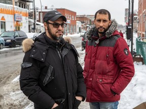"They're asking me questions every day," Parc-Extension resident Mohammed Amfizguy, left, said of his children, aged seven, 11 and 12. "'Papa, are we going to leave the neighbourhood and lose our friends'?" The pressure is also high for Amfizguy's evicted neighbour, Hicham Darwano, whose wife is expecting their second child in March.