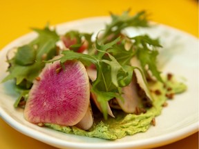 A combination of raw, grilled and lightly dressed radishes was set atop a healthy schmear of chive butter at Vinvinvin.