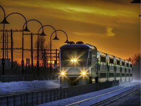 An Exo commuter train manufactured by Bombardier heads east through the Woodland station in Beaconsfield.