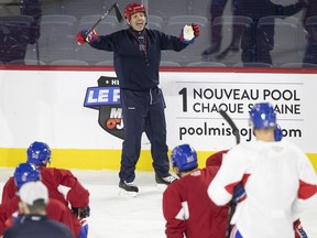 Rocket head coach Joel Bouchard talks to his players during practice in Laval on Feb. 18, 2020.
