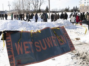 Protesters set up a blockade on the train tracks in Longueuil near Oak Ave. and St-Georges St. on Wednesday February 19, 2020, in support of the Wet'suwet'en.