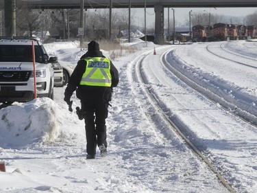 Police near blockade on the train tracks in Longueuil near Oak Ave. and St. Georges St. on Thursday February 20, 2020.