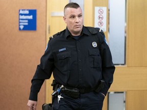 Sgt. Jimmy-Carl Michon during the coroner's inquest into the death of Pierre Coriolan, in Montreal on Tuesday, February 18, 2020.