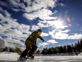 It's not spring yet. A skater makes the turn at the end of the frozen lake at the Laval Nature Centre.