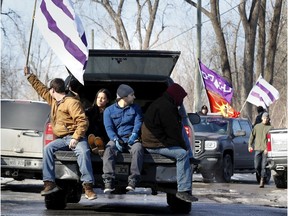 A slow-moving motorcade brings traffic to a crawl as Mohawks protest south of Montreal on Monday, February 24, 2020.