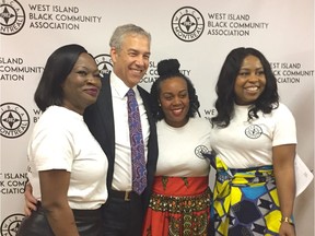 West Island Black Community Association treasurer Joan Lee, left, with then Pierrefonds-Dollard MP Frank Baylis, WIBCA chair Kemba Mitchell (in red skirt) and WIBCA vice-chair Maria Durant at 2019 event announcing the association's paying off of its mortgage.
