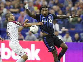 Montreal Impact's Romell Quioto, right, eludes Aubrey David, during second half of the CONCACAF Champions League game in Montreal on Feb. 26, 2020.