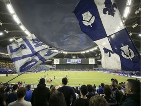 Fans cheer on the Montreal Impact during the opening minutes of the CONCACAF Champions League second leg against the Deportivo Saprissa in Montreal on Feb. 26, 2020.