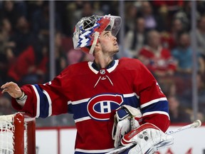 Canadiens goalie Charlie Lindgren watches replay on the scoreboard after giving up a goal to the Chicago Blackhawks during NHL game at the Bell Centre in Montreal on Jan. 15, 2020.