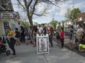 A summer day finds long lineups for ice cream outside Wild Willy's in Pointe-Claire. A corner lot next to the stand was slated for a condo project by Quorum Lakeshore Inc. until it was purchased by the city.