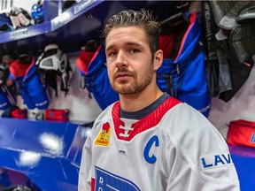 Defenceman Xavier Ouellet poses for photo after being named captain of the Laval Rocket at Place Bell on Oct. 2, 2019.