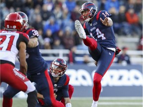 Montreal Alouettes kicker Boris Bede and holder Matthew Shiltz watch Bede's field goal split the uprights during a game against the Calgary Stampeders in Montreal on Oct. 5, 2019.
