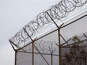 Barbed wire tops the fences as officials conducted a media tour of the Ottawa Carleton Detention Centre on Innes Rd.   photo by Wayne Cuddington/ Postmedia ORG XMIT: POS1610271233093115