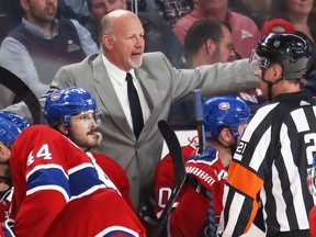Montreal Canadiens head coach Claude Julien discusses a penalty call with referee TJ Luxmore during third period of National Hockey League game against the Ottawa Senators in Montreal Wednesday November 20, 2019.