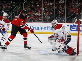 Devils' Wayne Simmonds watches his shot fly past the mask of Canadiens goalie Charlie Lindgren Tuesday night at the Prudential Center in Newark, N.J.