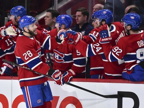 Canadiens' Marco Scandella celebrates his goal with teammates on the bench during the third period against the Toronto Maple Leafs at the Bell Centre on Saturday, Feb. 8, 2020, in Montreal.