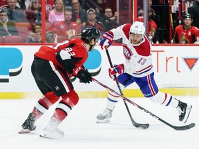 Canadiens' Max Domi shoots the puck against Senators' Christian Jaros at Canadian Tire Centre on Saturday, Feb. 22, 2020, in Ottawa.