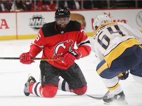 Devils' P.K. Subban moves the puck away from Predators' Mikael Granlund during a game last week. Subban is having the worst season of his NHL career, having scored only six goals and 11 points so far.