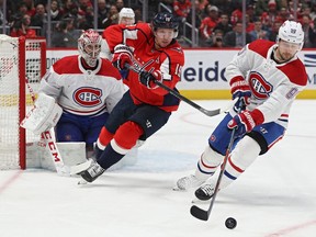 Canadiens' Tomas Tatar skates past Capitals' Nicklas Backstrom in front of goalie Carey Price Thursday night in Washington.