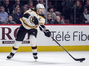 Boston Bruins captain Zdeno Chara passes the puck during NHL game against the Canadiens at the Bell Centre in Montreal on Dec. 9, 2015.